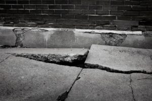 Broken sidewalk with big cracks 