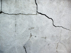 Close up on cracked house foundation made of cement blocks