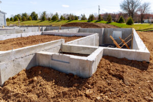 Concrete foundation with reinforcement and metal slab